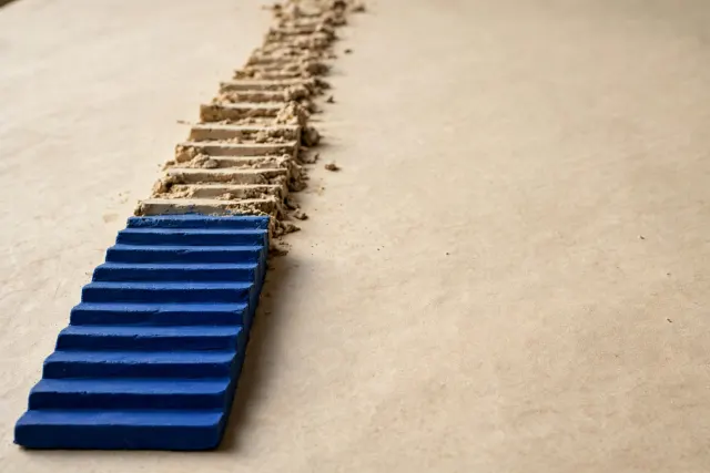Illustration: A row of forty tiny clay steps of which only the first eight are sharp and cobalt blue — a visual metaphor for Qwen-Image-Turbo cutting diffusion steps from forty to eight.