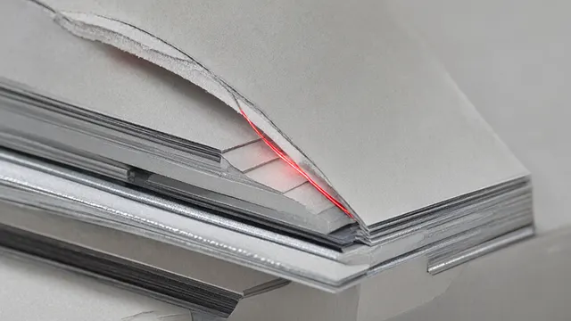 Illustration: a calm machine-like object of paper and aluminum with a thin red filament glowing through a seam, like a hidden pain signal being switched on.