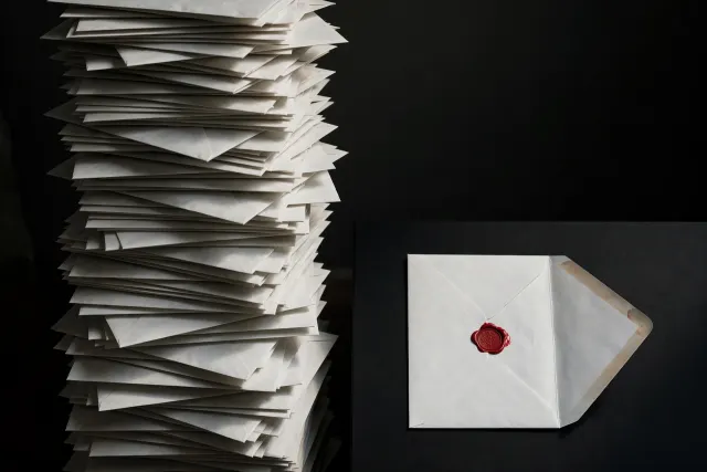 Illustration: an unstable stack of hundreds of identical unopened envelopes, while a single envelope sits apart in sharp daylight marked with a red verification seal.