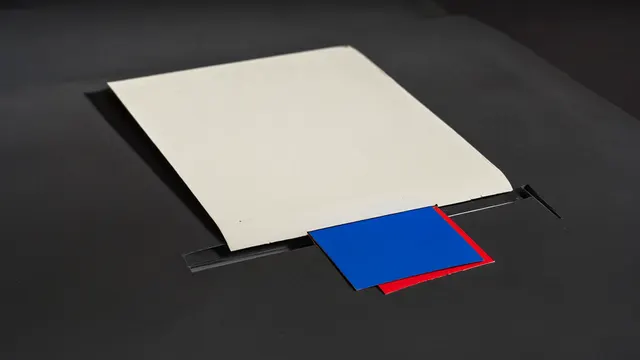 Illustration: a blank photographic print slides out of a printer, with an empty ad slot as a thin cutout in the table directly beneath the image — visualizing a visible ad format under ChatGPT image generation.