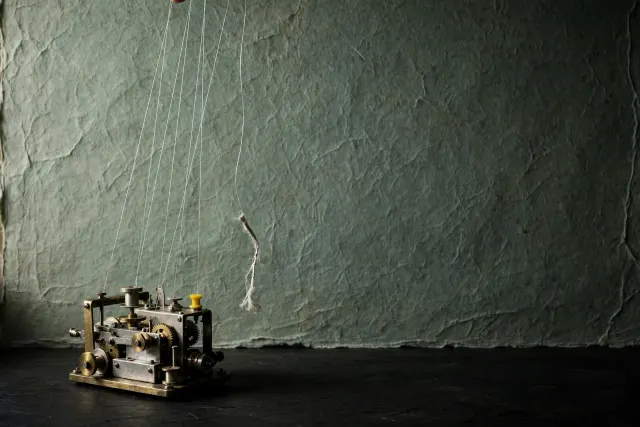 Illustration: a small machine controlled by visible puppet strings vanishing out of frame, one string cut – a metaphor for hijacked coding agents.