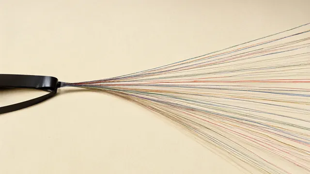 Illustration: a single reel of audio tape splits into dozens of thin colored threads fanning out across warm paper — one voice multiplied into many languages.