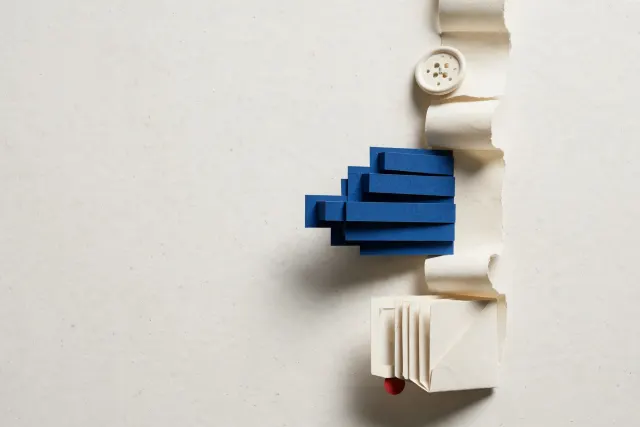 Illustration: a paper conversation strip from which physical elements — a button and a chart — pop out, symbolizing interactive responses in ChatGPT.