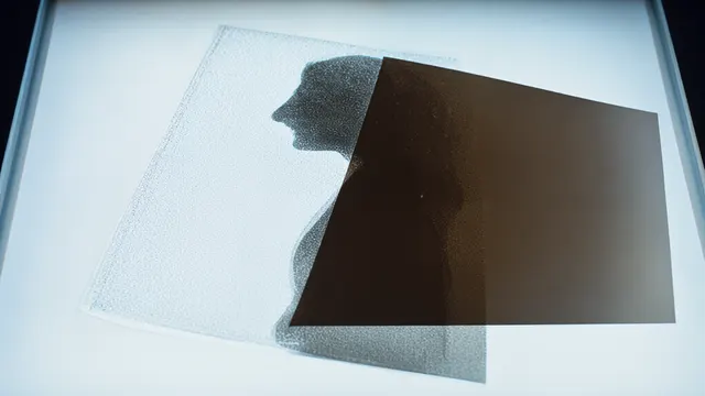 Two translucent medical film layers overlap on a light table, their intersection forming one clear silhouette, an illustration of ultrasound and tomosynthesis merged into a single risk assessment.